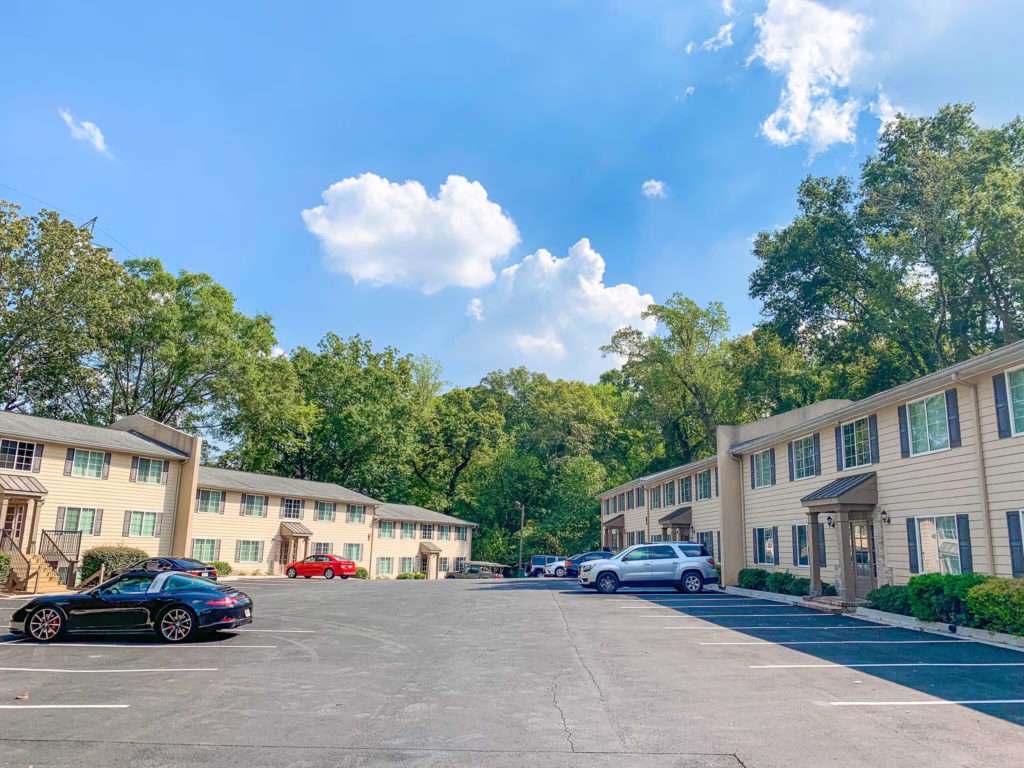 Exterior view of Enclave at Riverside Village multifamily property at 2145 Bolton Road, Atlanta, GA, sold by Stratus Property Group.