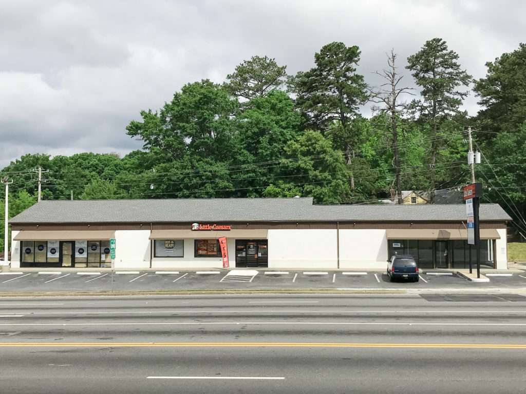 Exterior view of the retail property at 5475 Buford Highway, Norcross, GA, sold by Stratus Property Group.