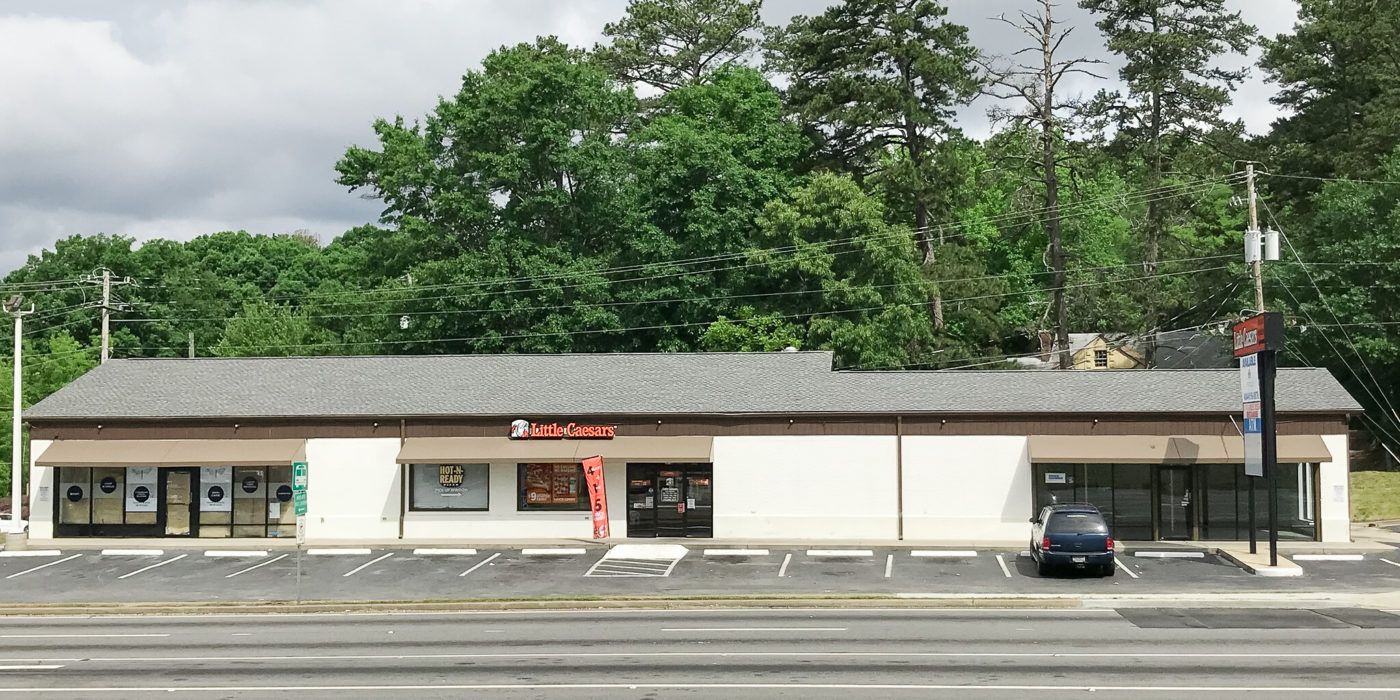 Exterior view of the retail property at 5475 Buford Highway, Norcross, GA, sold by Stratus Property Group.