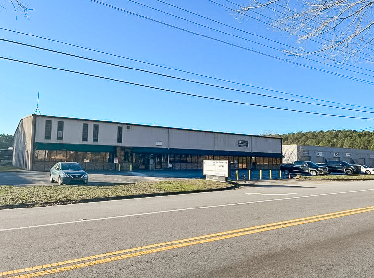 Exterior view of the industrial property at 3150 Florence Road, Powder Springs, GA, sold by Stratus Property Group.