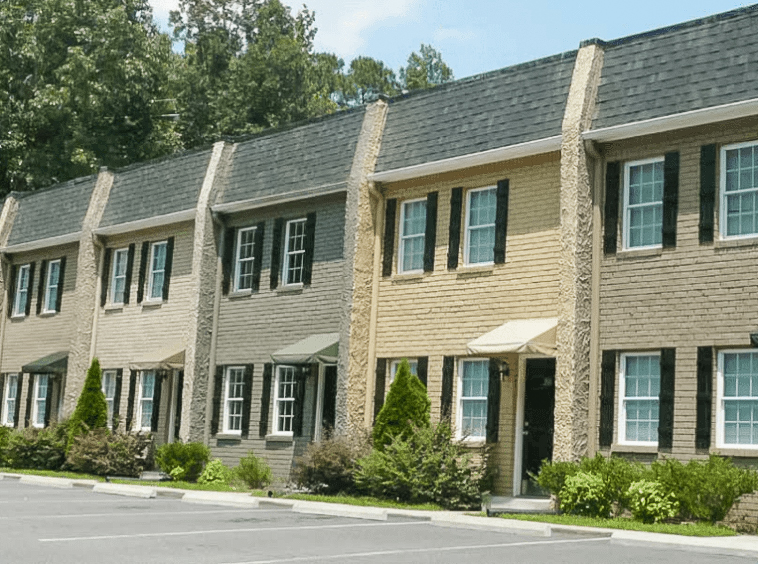 Exterior view of Stone Creek Townhomes in Norcross, GA, sold by Stratus Property Group.